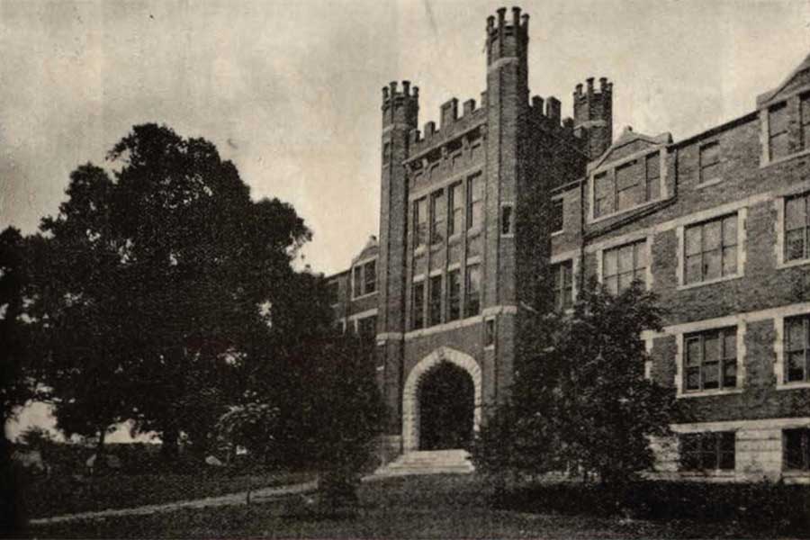 Historic black-and-white photograph showing Old Main on Marshall University's campus with a large American beech tree in the foreground, as published in the 1919 Mirabilia yearbook.