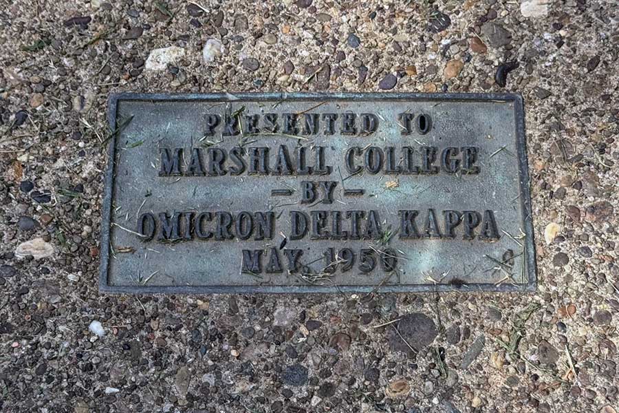 Bronze dedication plaque set into the pavement at the Omicron Delta Kappa Circle reading, "Presented to Marshall College by Omicron Delta Kappa, May 1950."