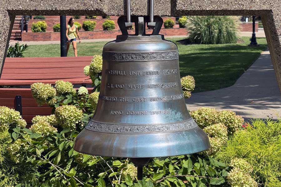 Bronze commemorative bell suspended within a concrete frame at Thornburg Bell Plaza, bearing an inscription recognizing C.I. and Marie A. Thornburg's gift of the Morrow Library carillon bells.